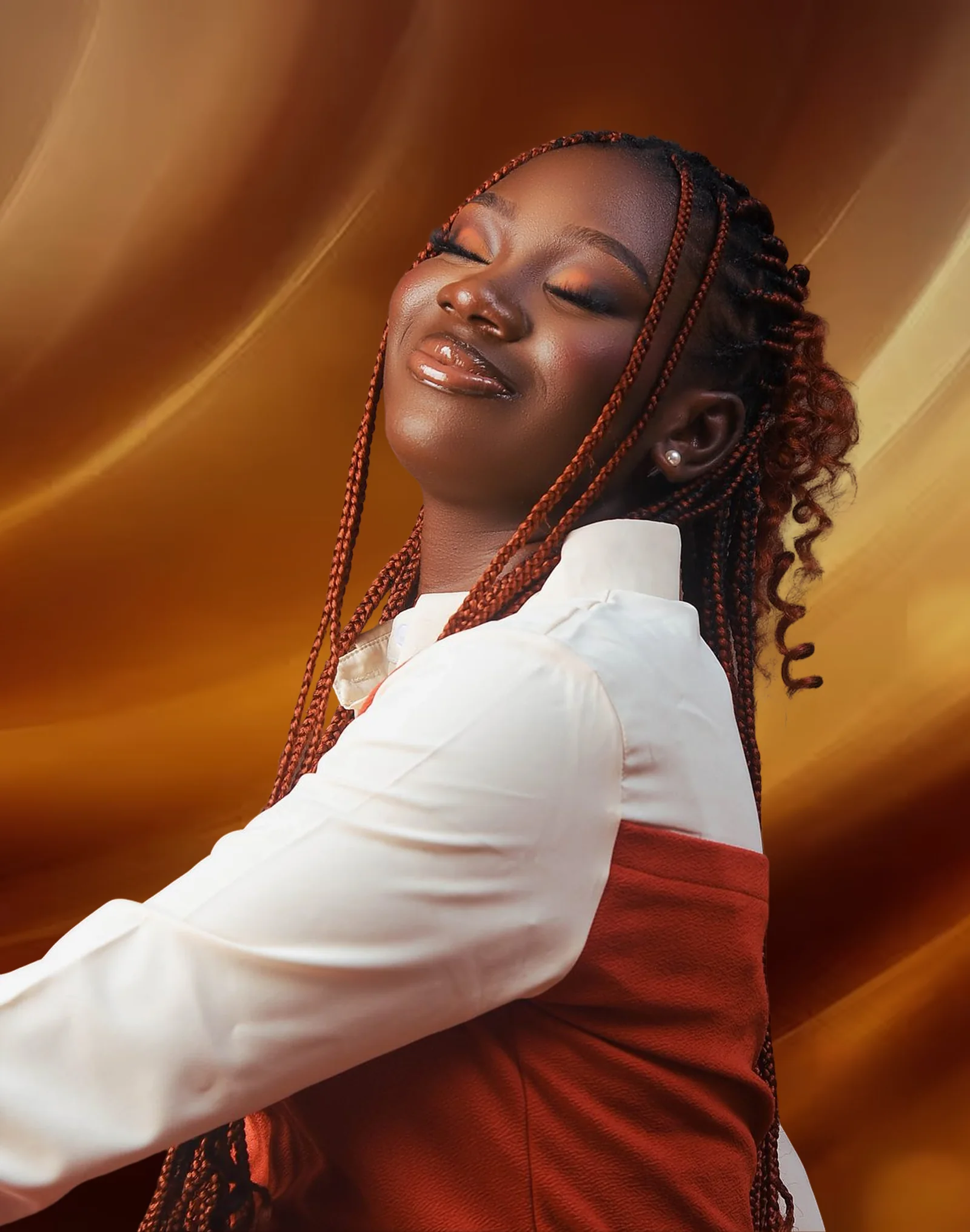 Anjolaoluwa Akinosun smiling with her eyes closed